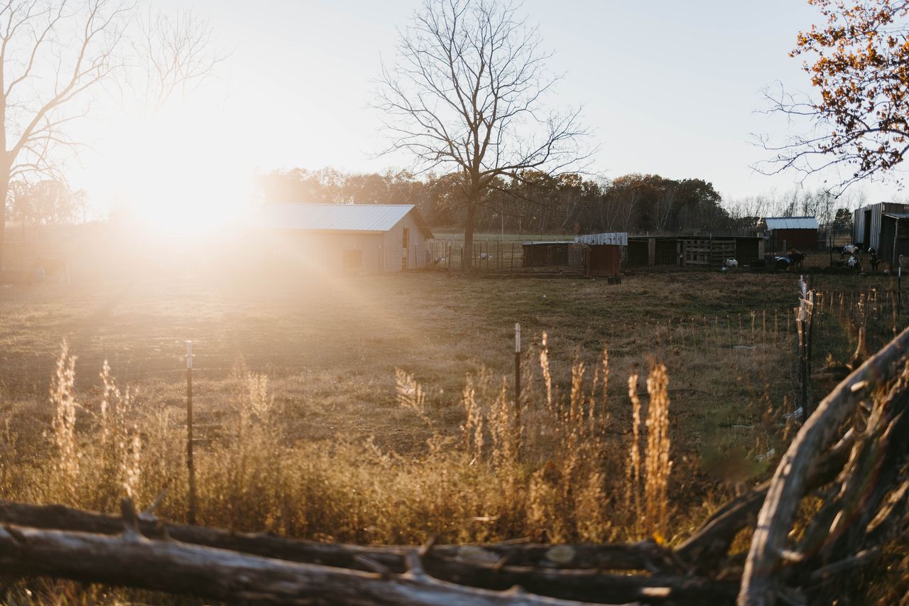 The sun setting over the barns and pastures of Gooseberry Bridge Farm.